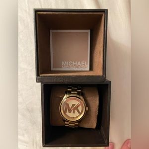 Original MK watch. Small scratch on glass on Upper left. Been kept in case.